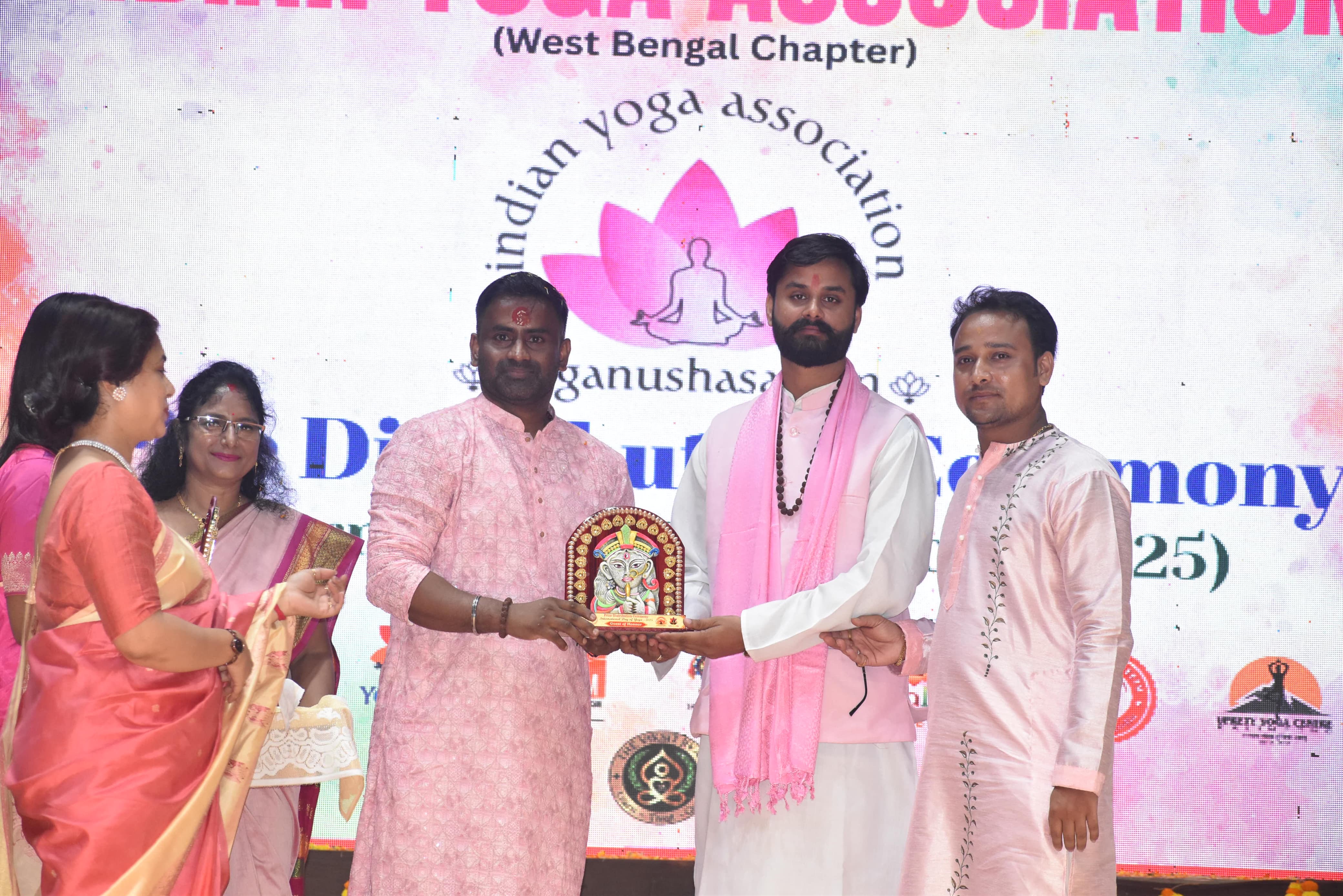 Dr. Shivam Mishra lighting ceremonial lamp at Indian Yoga Association event